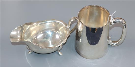 A 1950s silver mug by Adie Brothers and a 1930s silver sauceboat, 13 oz.